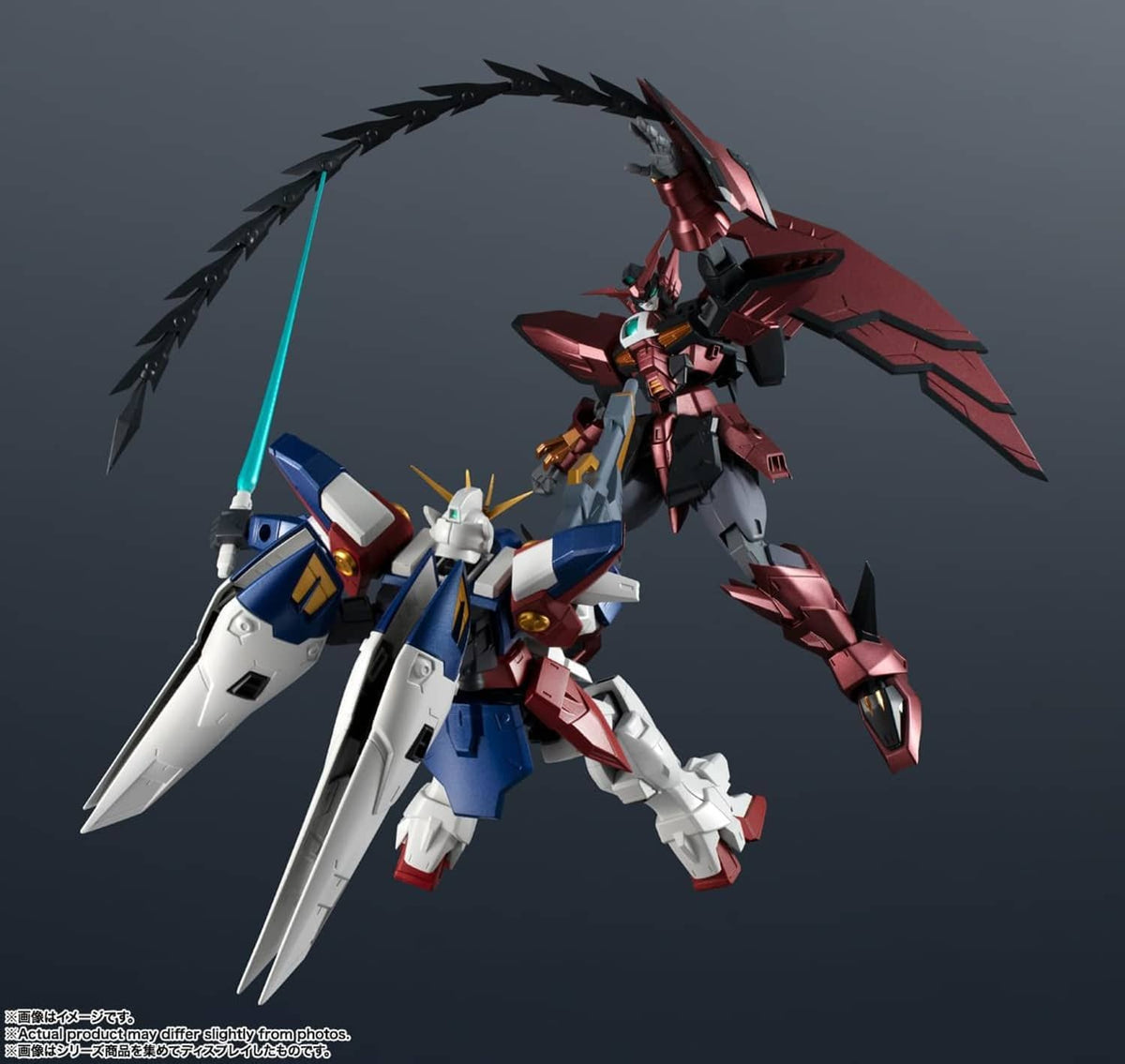 Winged mecha action figures in red, black, white, and blue with raised weapons