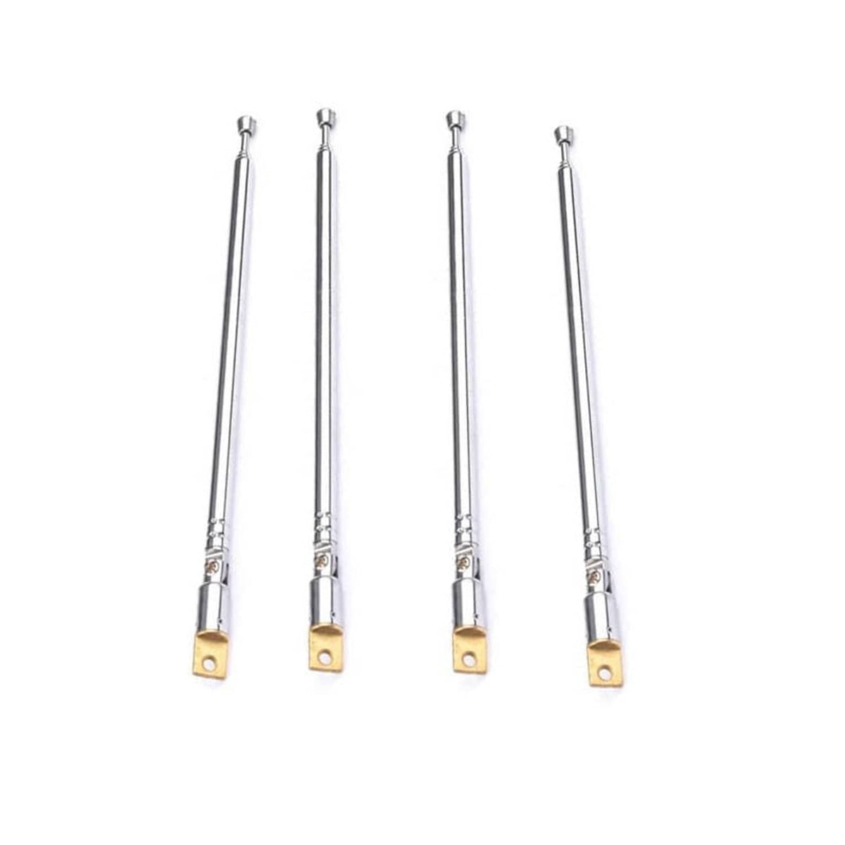 Set of four silver telescopic radio antennas standing with gold mounting base plates