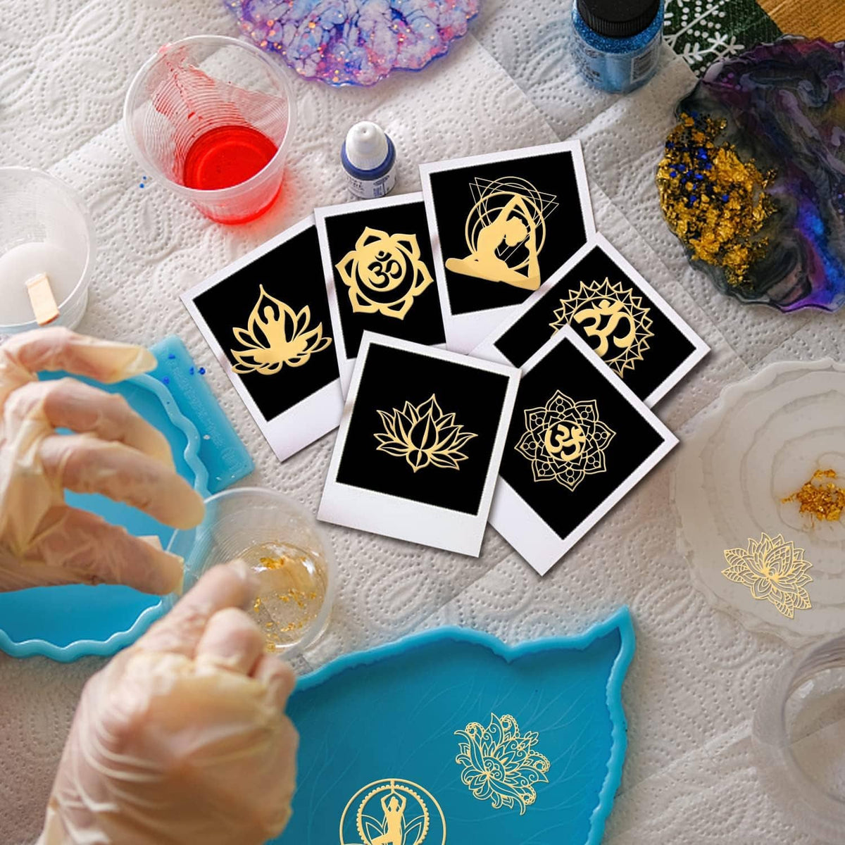 Gold yoga chakra stickers on cards, including lotus, Om, and meditating figure