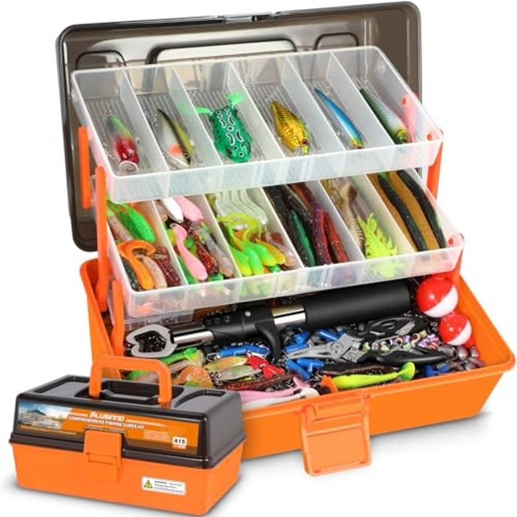Open orange 3-layer tackle box with clear trays holding colorful fishing lures and hooks