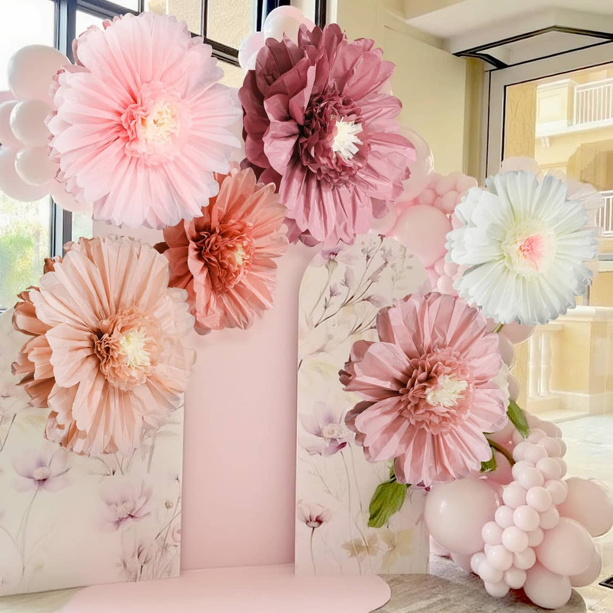 Set of giant tissue paper flowers in pink and white, round rosette style