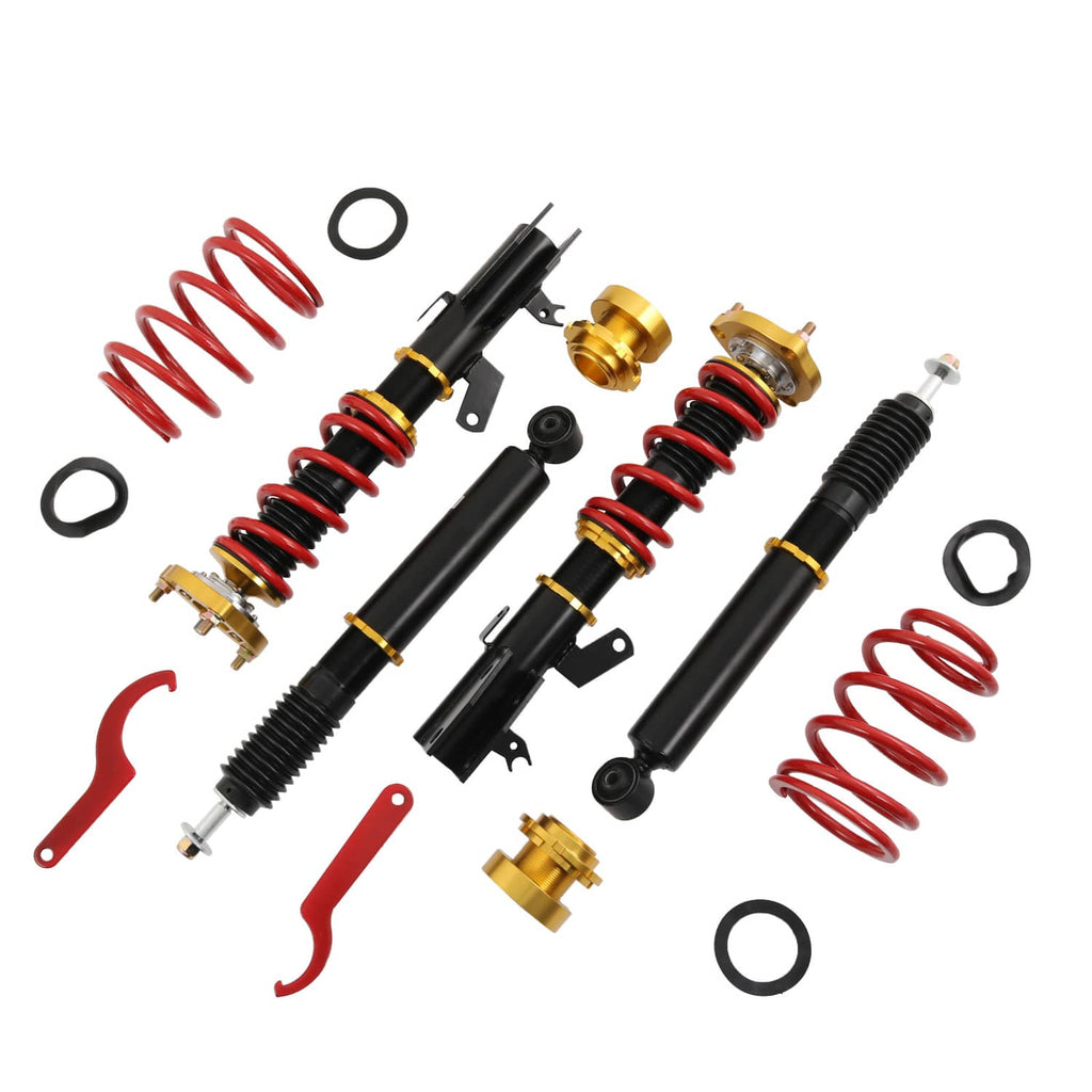 Coilover suspension kit components: red coil springs, black struts, and gold mounts