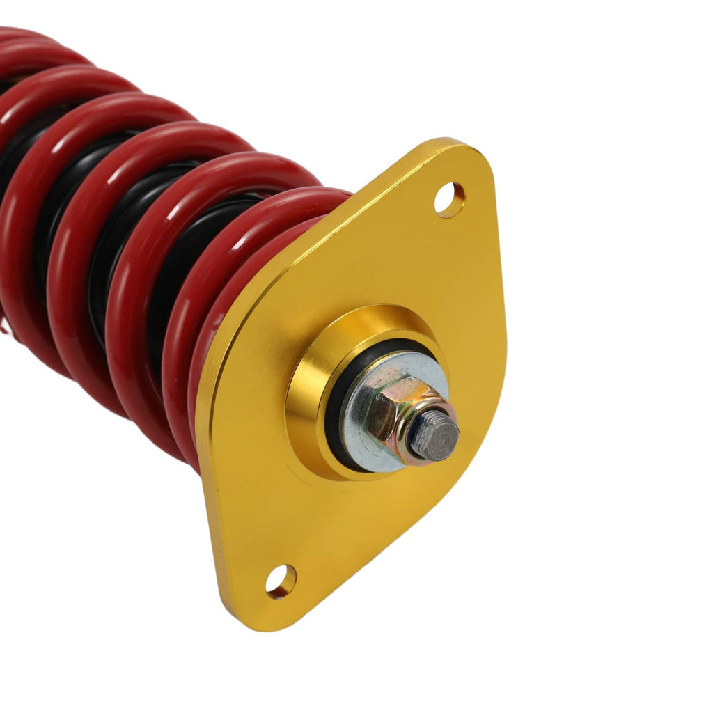 Coilover spring perch plate with gold finish and red coil spring