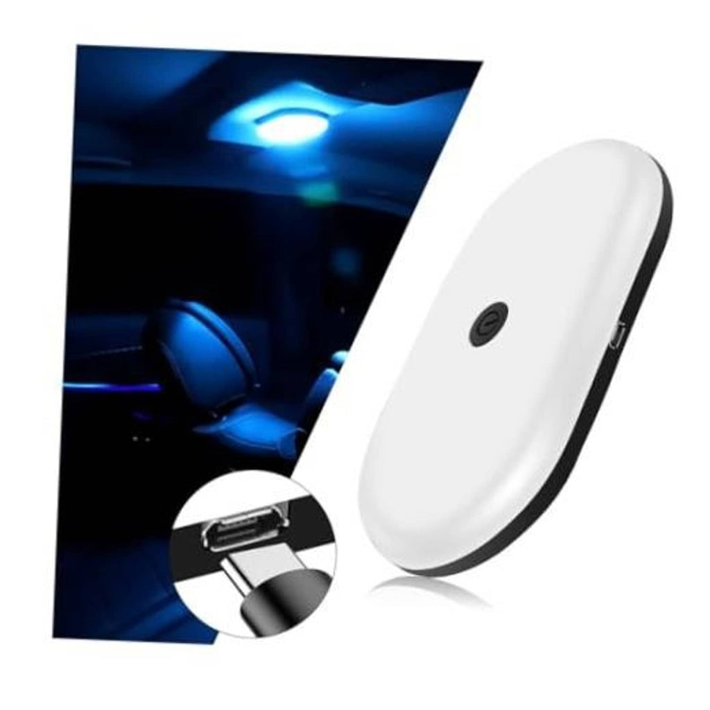 White car ceiling dome reading light with blue LED glow, compact oval body.