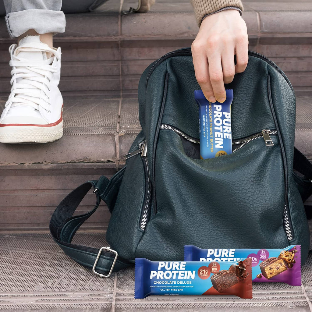 Protein bars in a tote bag with a chocolate deluxe bar wrapper visible