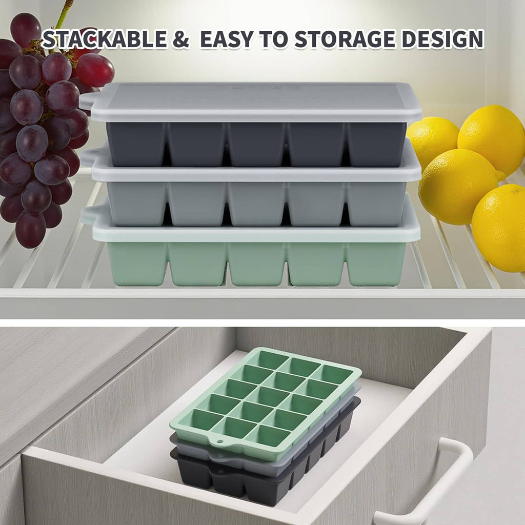 Stackable silicone ice cube trays in dark gray and mint green, stored in freezer