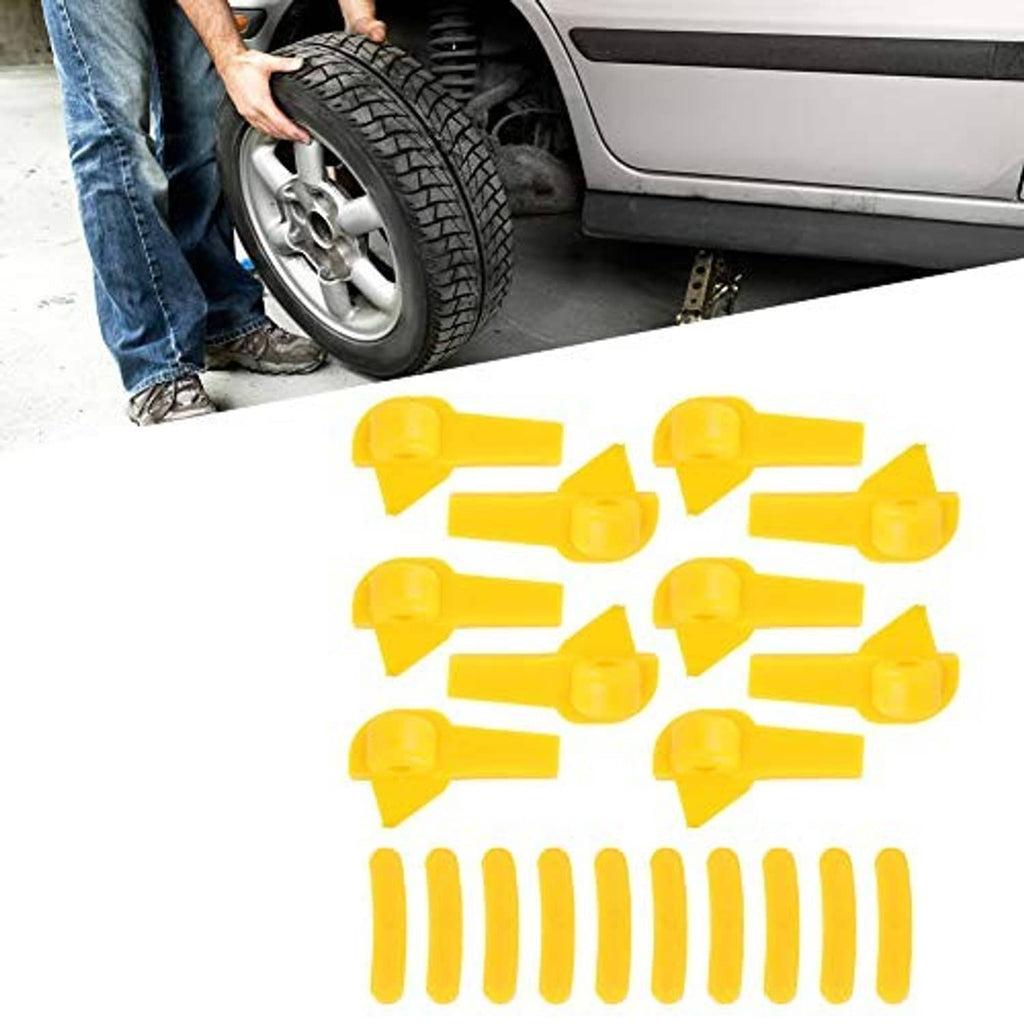 Yellow tire changer duck head insert set shown near a car wheel during mount/demount work