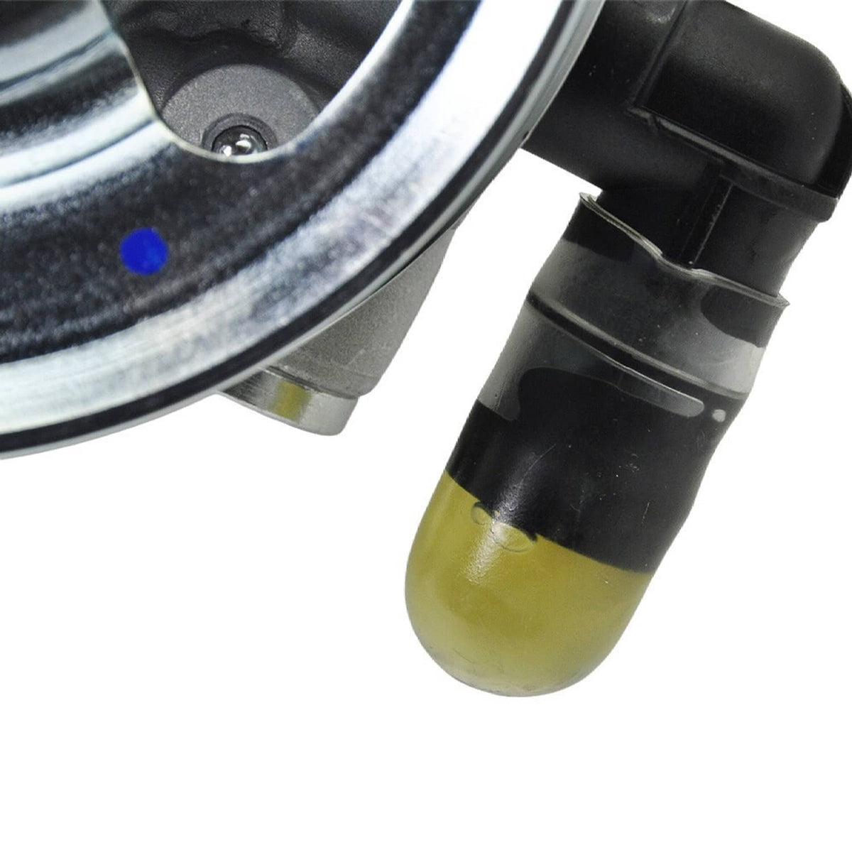 Power steering pump reservoir with yellow fluid and black cap, close-up