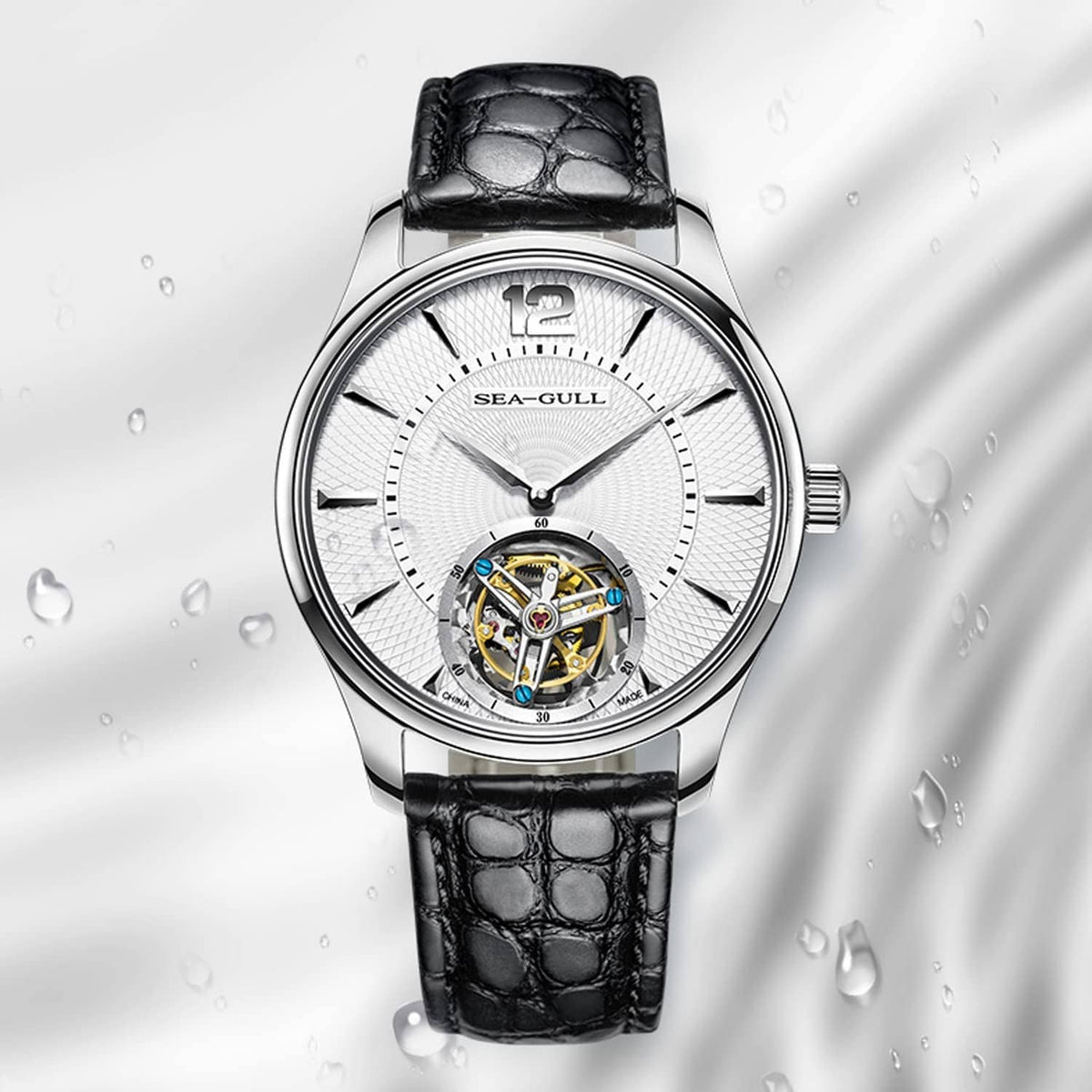 Black alligator-style leather watch band on round metal watch case