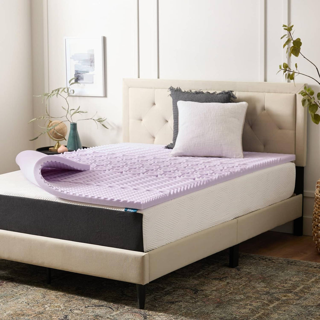 Lavender-infused memory foam mattress topper on a bed, purple quilted surface