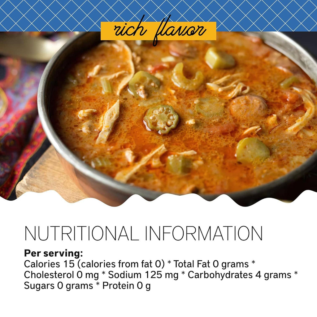 Close-up of thick orange-brown gumbo with okra and sausage pieces in a pot