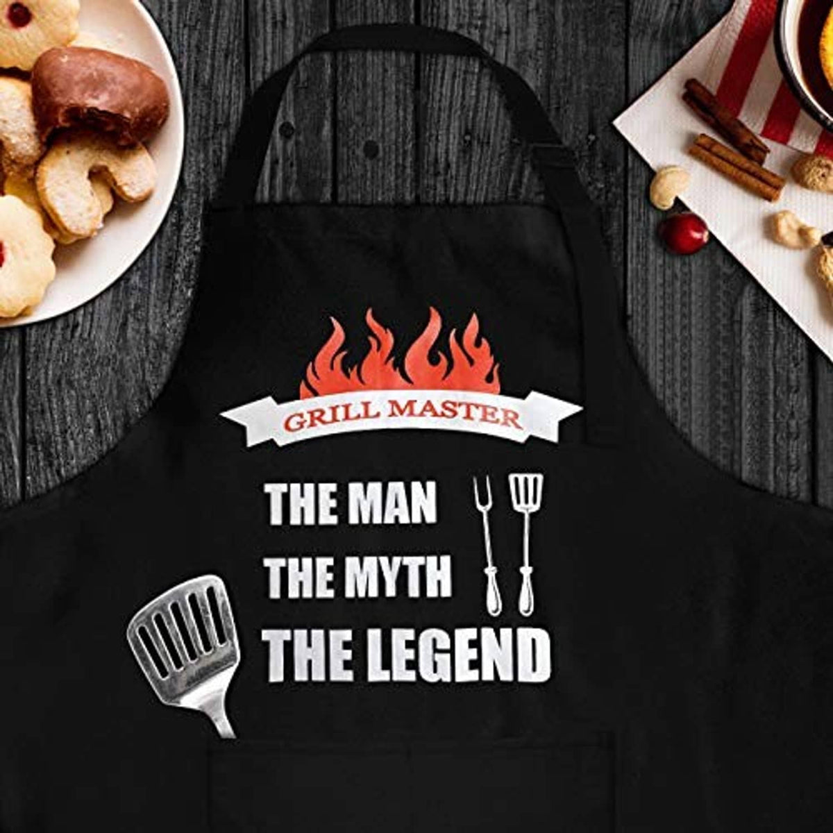 Black grilling apron with flame “Grill Master” emblem and “The Man The Myth The Legend” print