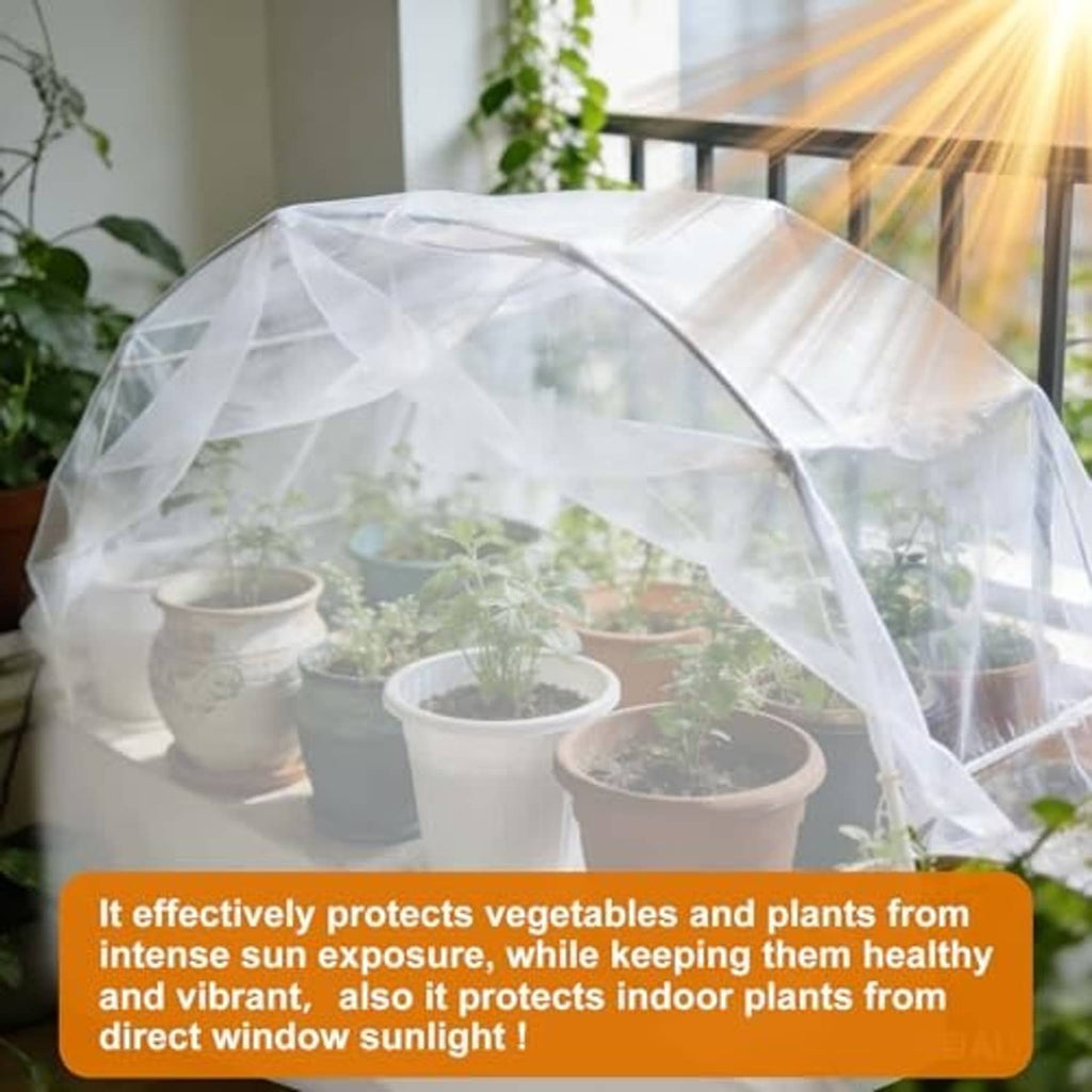 White translucent shade cloth cover arched over potted plants near a window.