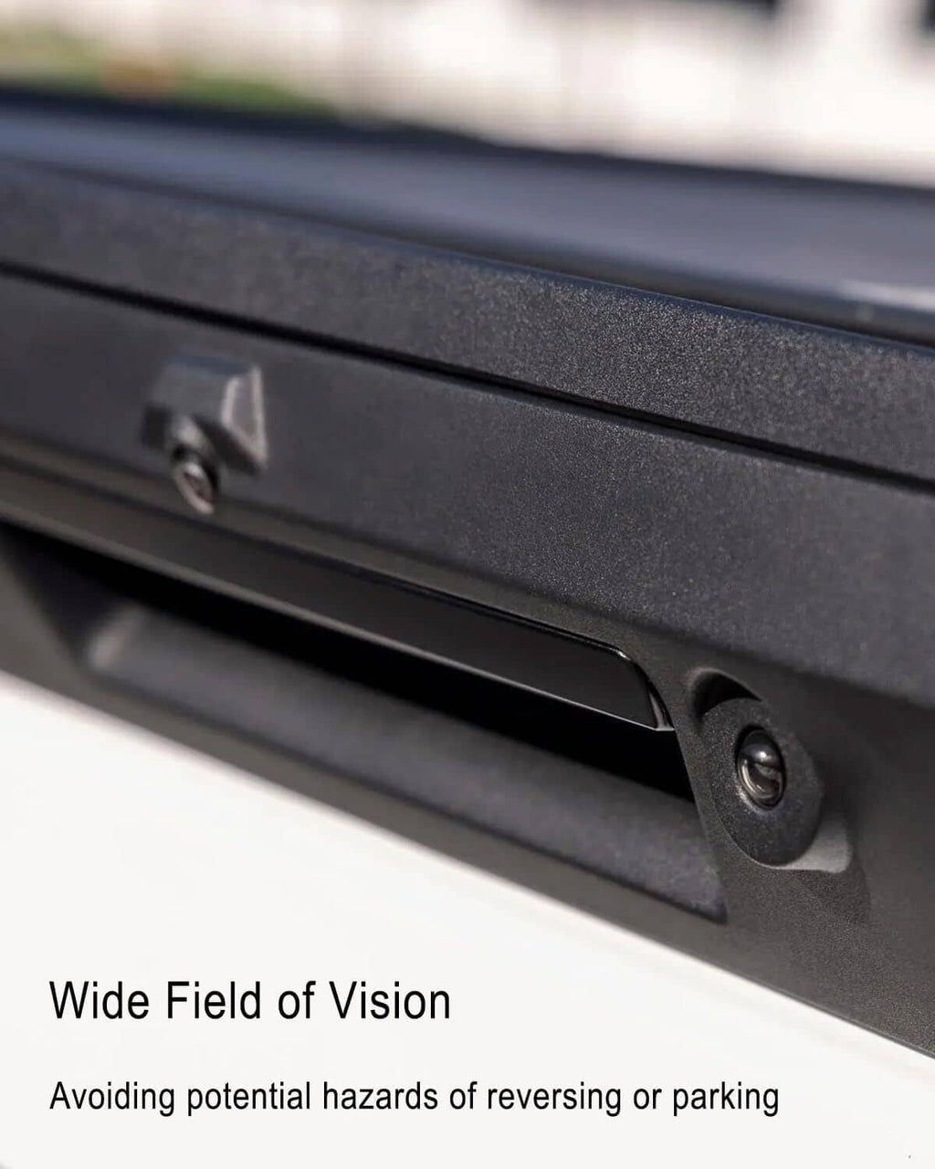 Black tailgate handle with integrated rear-view backup camera, close-up mounting screw