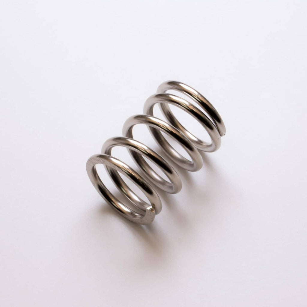 Nickel-plated valve spring coil, single coiled spring in metallic silver