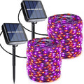 Solar string lights with purple LEDs and orange dots, two coiled strands and solar panels
