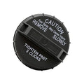 Black fuel tank filler cap top view with CAUTION and REMOVE warning text