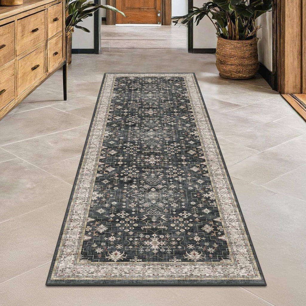 Black runner rug with floral motifs, gray-beige border trim, washable.