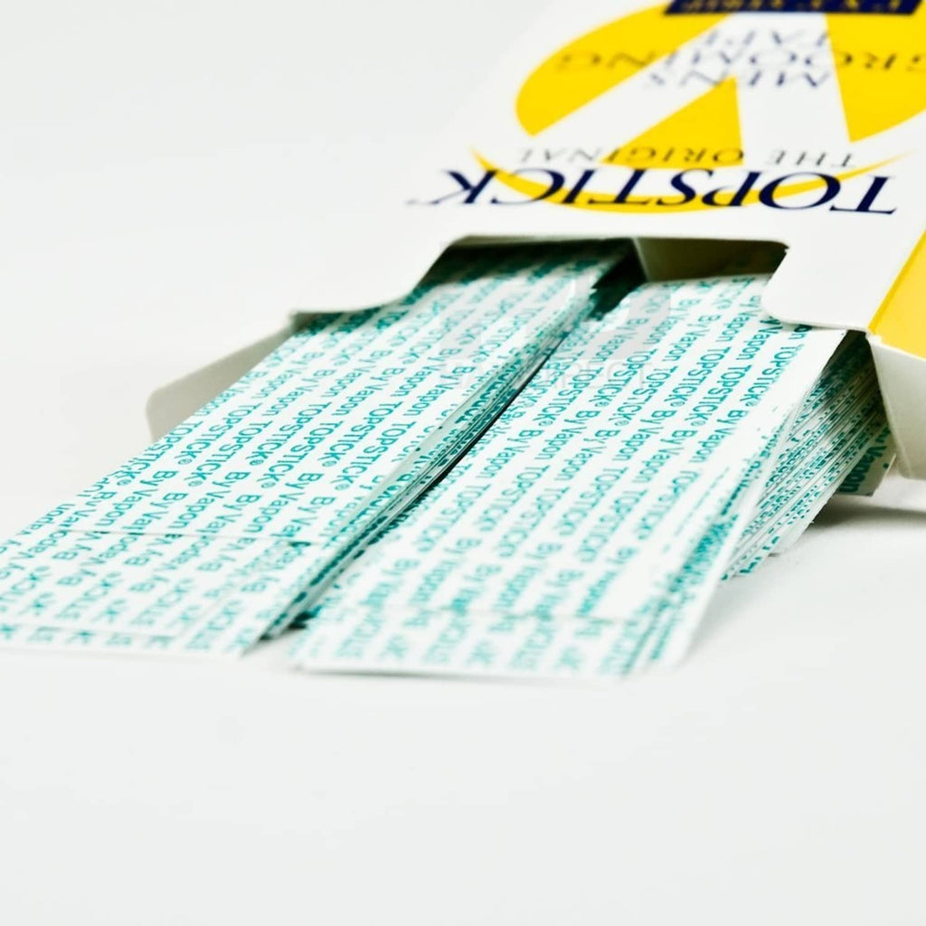 Clear adhesive tape strips, 1" x 3", stacked in open box