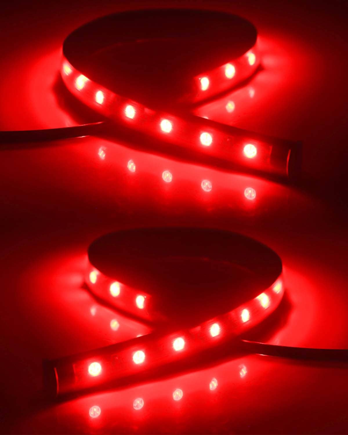 Two red LED light strips glowing with multiple diodes on flexible tubing
