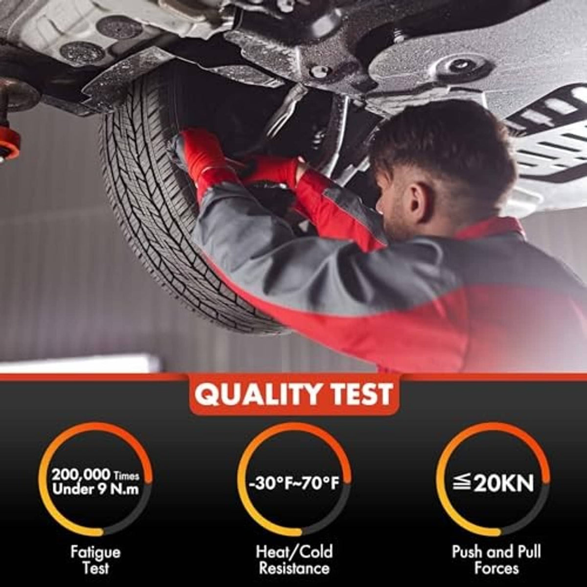 Mechanic installing a ball joint under a vehicle using a wrench on the suspension