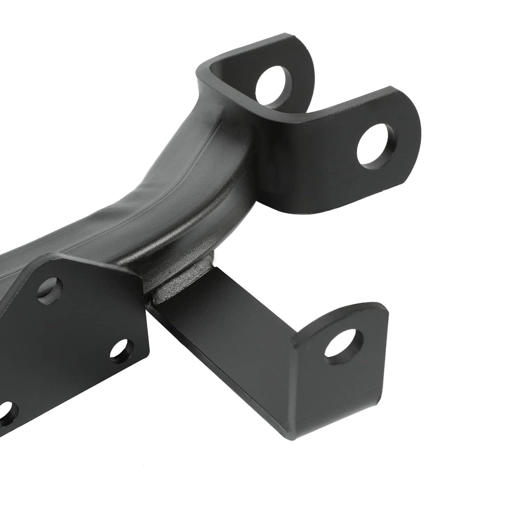 Close-up of black steel axle lift bracket joint with mounting tabs and holes