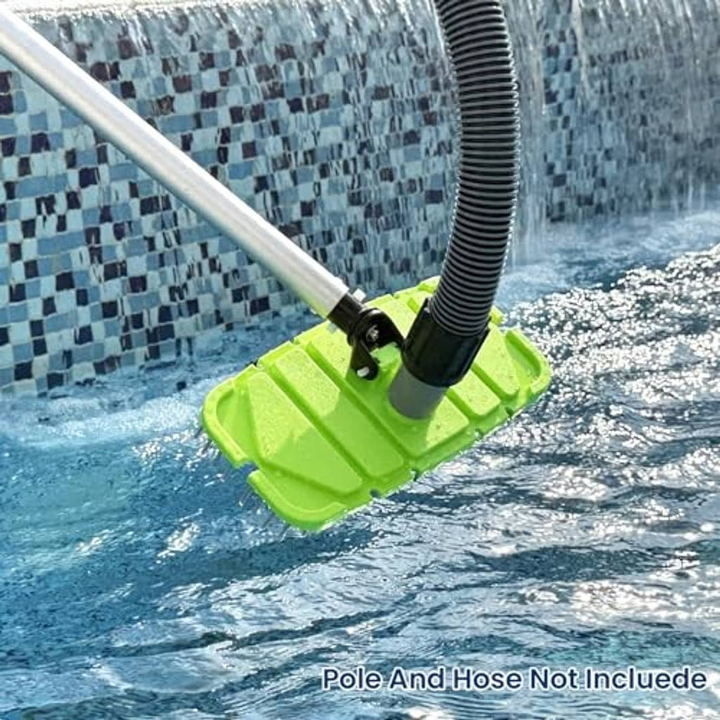 Green pool vacuum head with brush bristles in water attached to suction hose