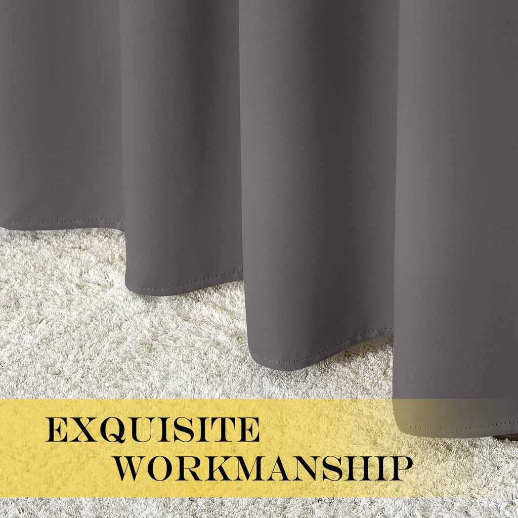 Grey blackout curtain hem draping over a carpeted floor