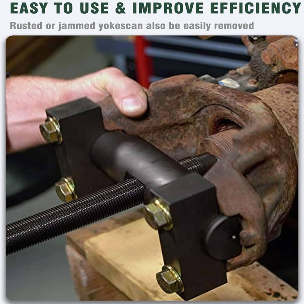 Yoke puller tool clamped on rusty axle yoke with brass nuts on threaded screw