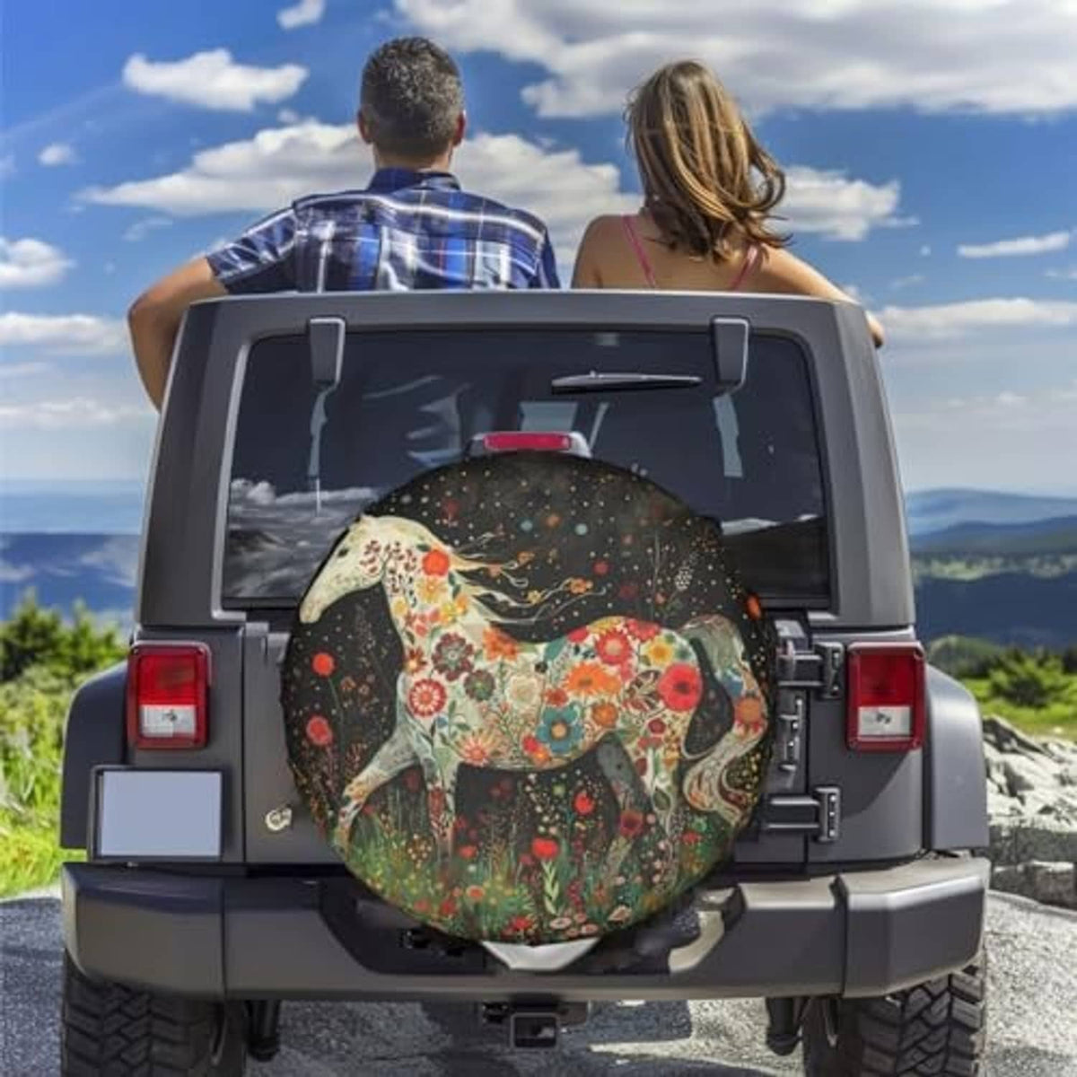 Spare tire cover with floral horse artwork mounted on an SUV rear