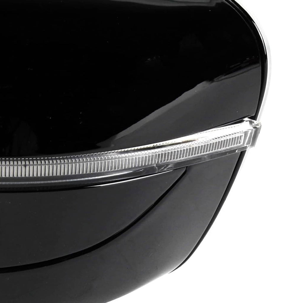 Close-up of black side mirror turn-signal strip and lens edge with glossy finish.