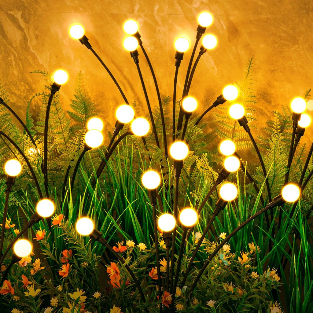 Solar starburst outdoor lights set of 6 with glowing round LED bulbs on stakes
