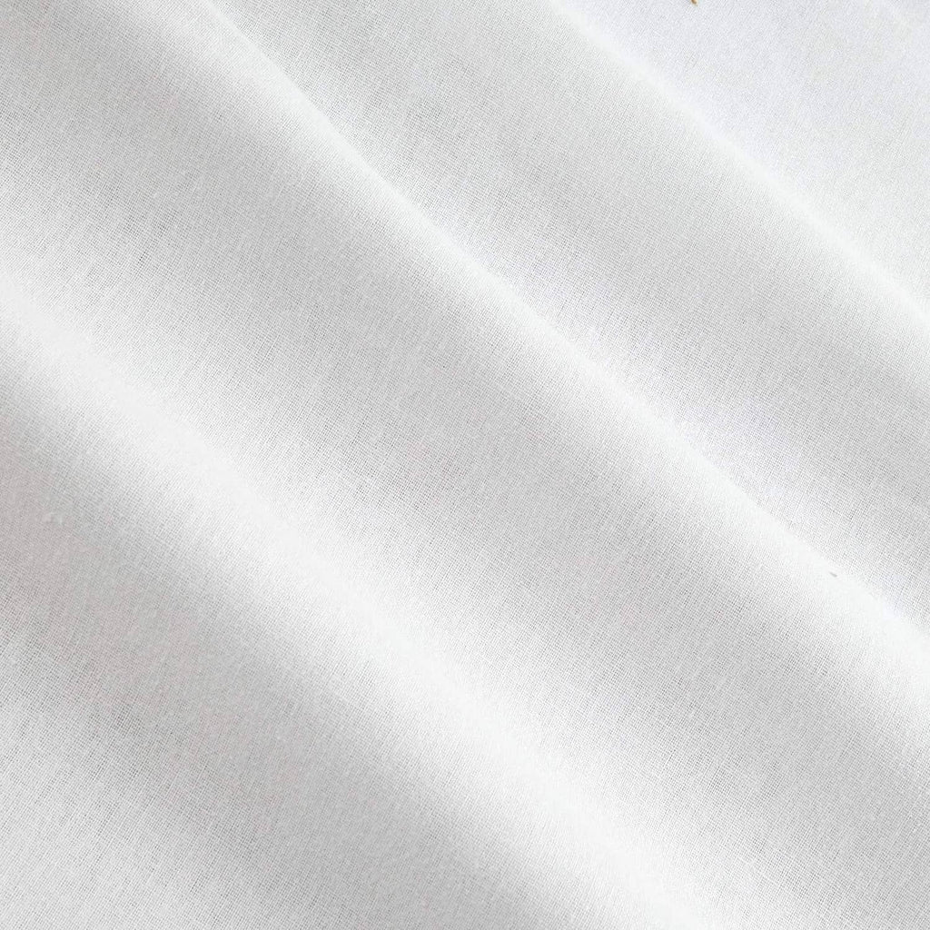 White woven interfacing fabric close-up with smooth fused texture