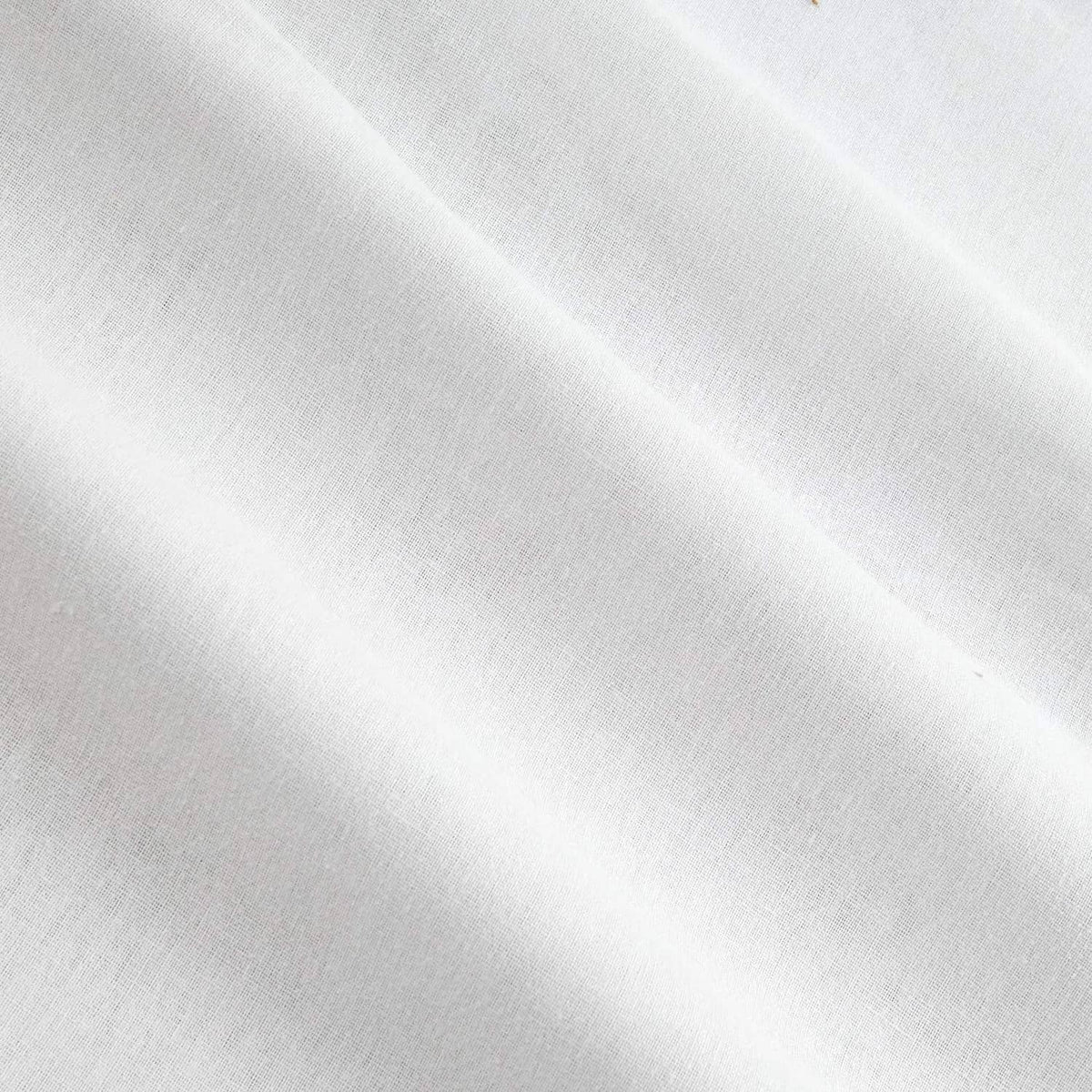 White woven interfacing fabric close-up with smooth fused texture