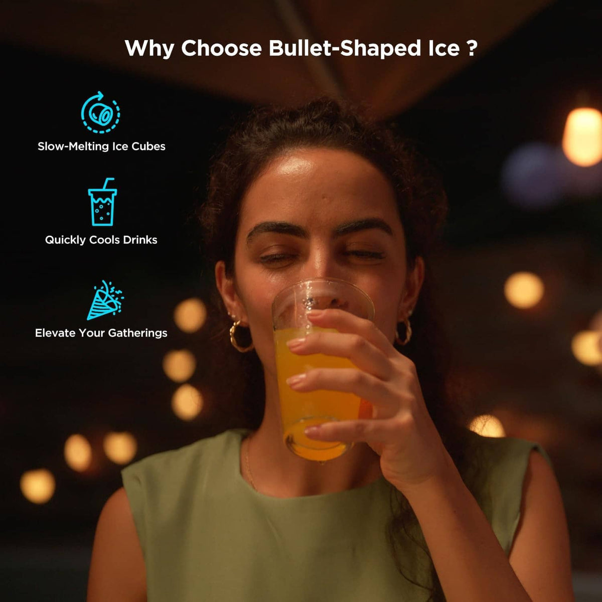 Person holding a clear glass with ice, featuring a bullet-shaped ice maker concept