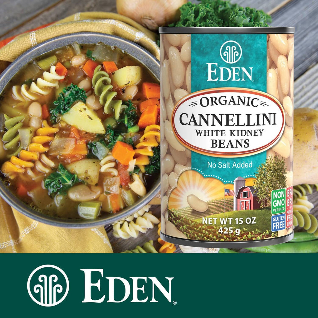Organic cannellini beans can beside vegetable soup bowl, no salt added, 15 oz