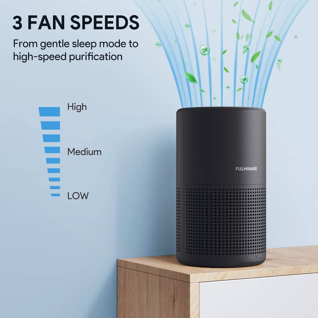Black air purifier cylinder with front perforation grille and top fan vent