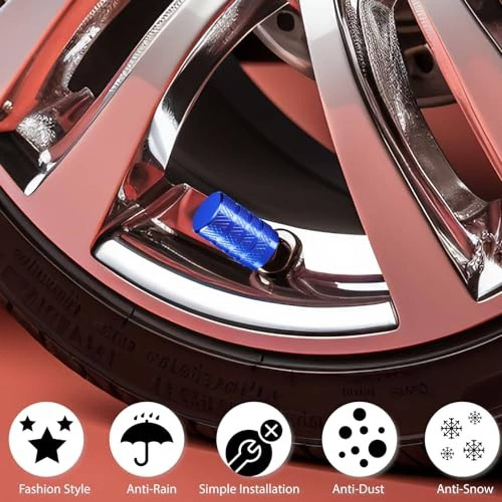 Blue anodized aluminum tire valve stem caps near a wheel rim; knurled diamond surface