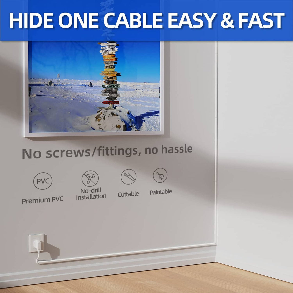 White cord hider raceway installed along baseboard with cord neatly hidden