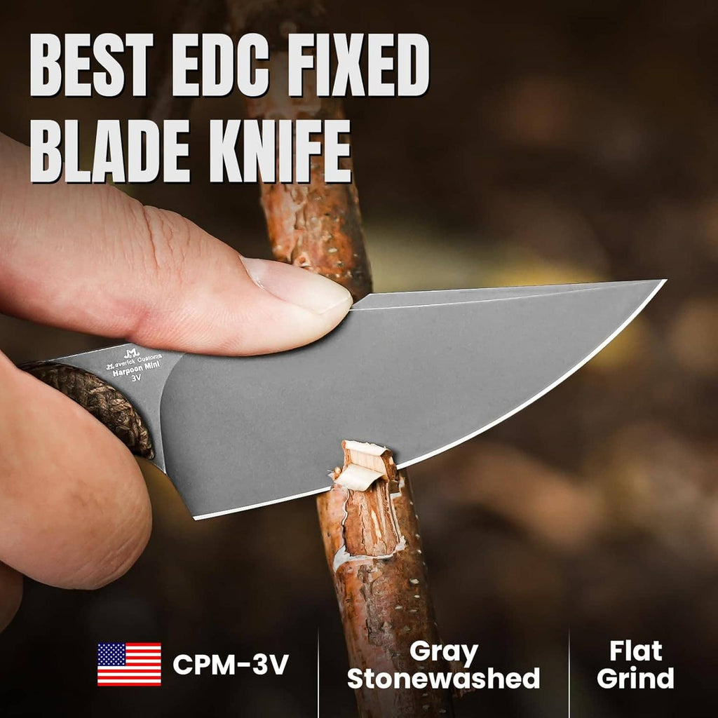 Handheld fixed blade knife with gray blade and tan micarta handle