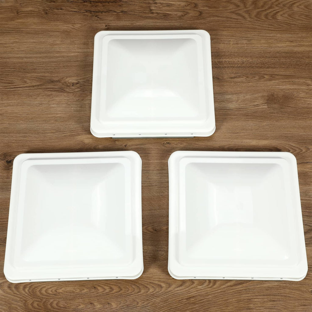 Three white square RV roof vent cover lids, flat top design