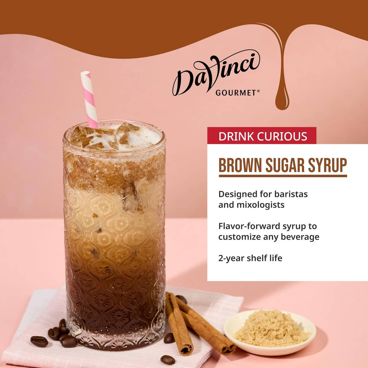 DaVinci Gourmet brown sugar syrup with iced drink, cinnamon sticks, and cookie pieces