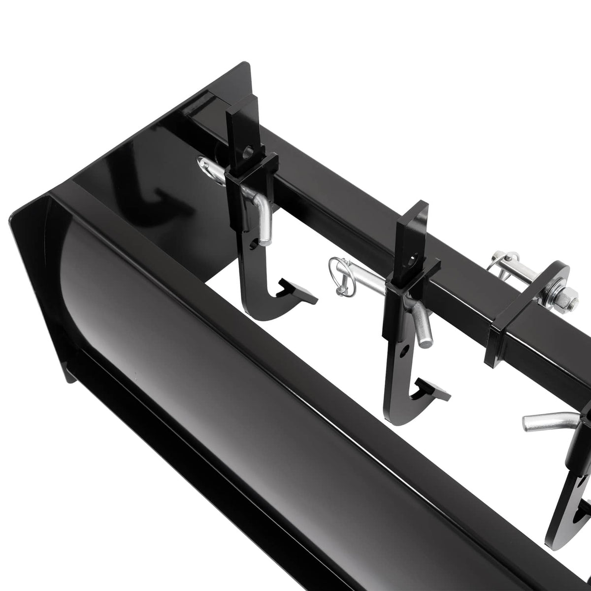 Tow-behind scraper blade gearbox area with hanging chain hooks and mounting components
