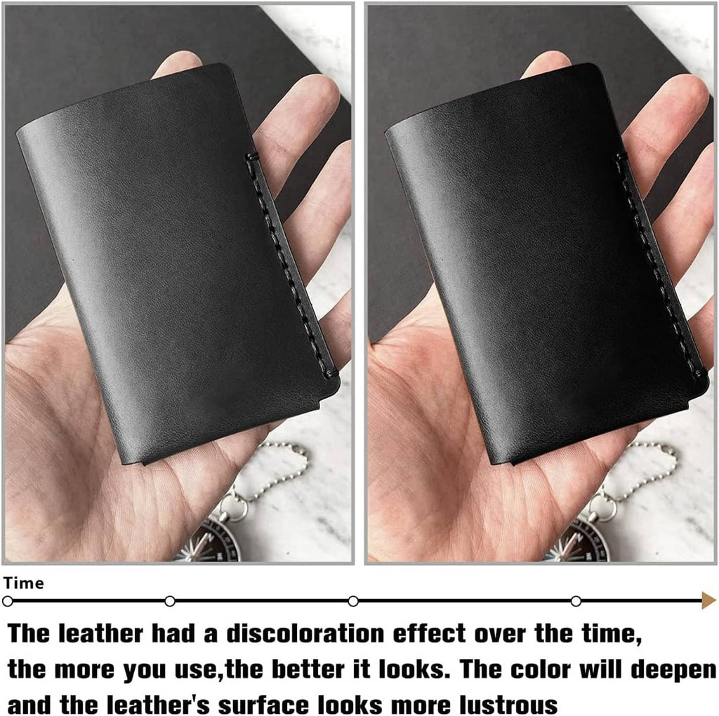 Black leather card case or wallet with stitched edge, held in hand