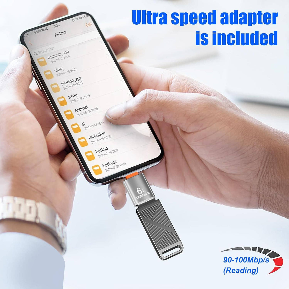 Grey USB flash drive with USB-C adapter connector held in hands