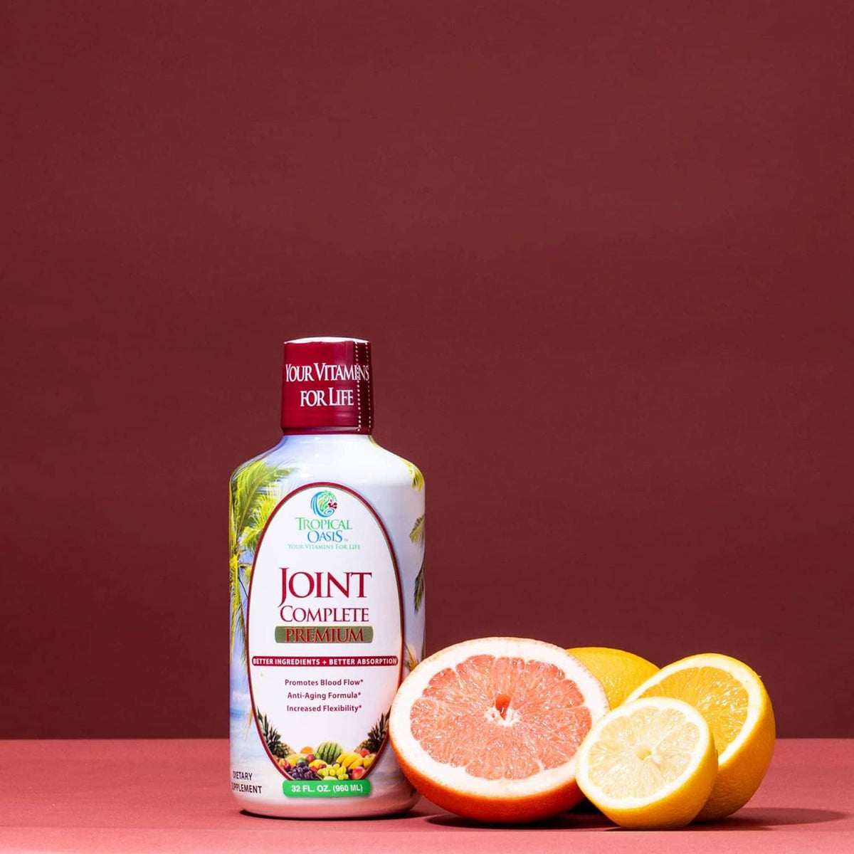 Liquid joint supplement bottle with Joint Complete Premium label and citrus slices