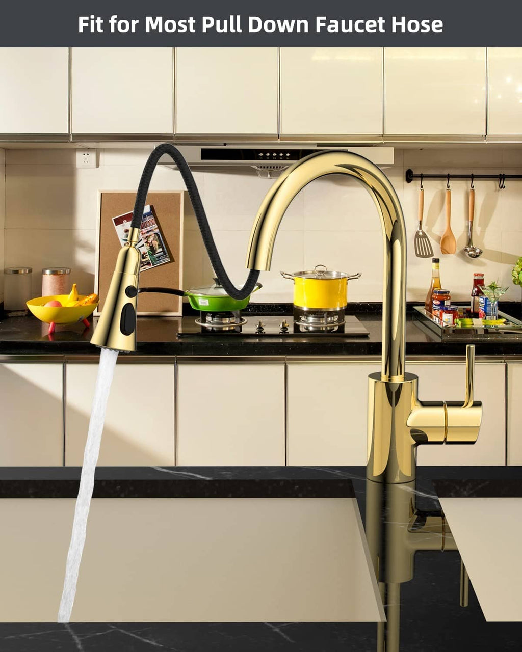 Polished brass kitchen faucet sprayer head with water stream attached to pull-down spout