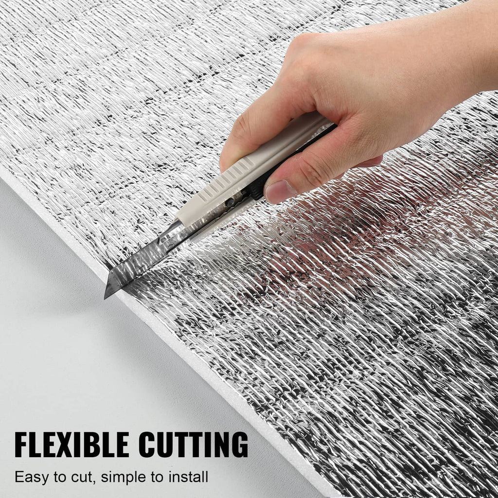 Reflective insulation barrier sheet being cut with a utility knife