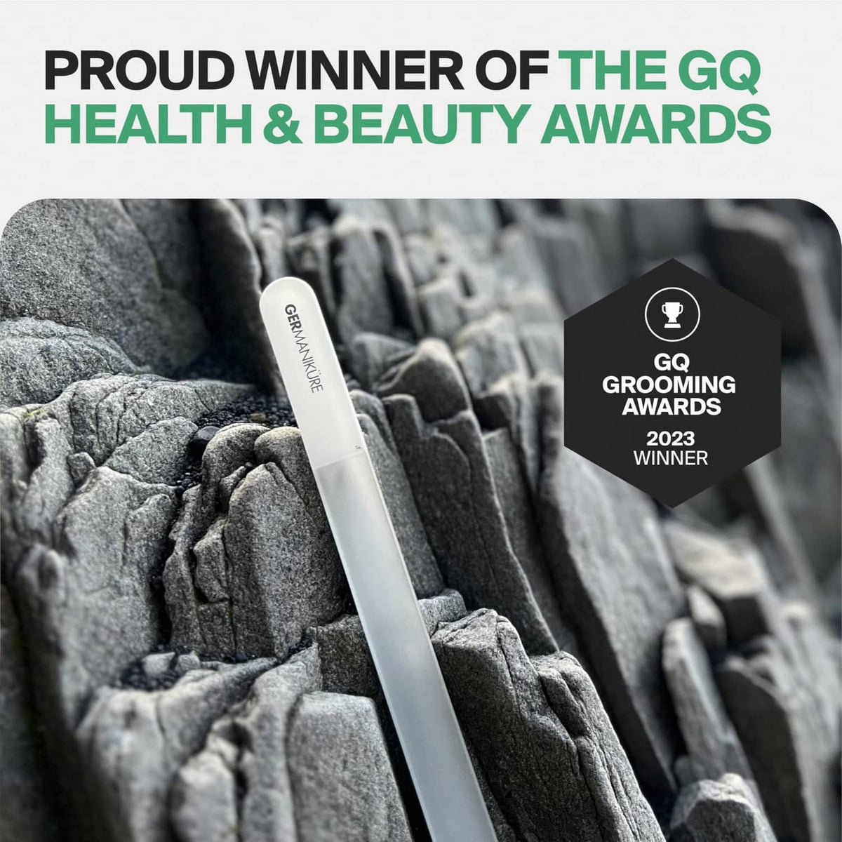 Gray glass nail file resting on textured fabric