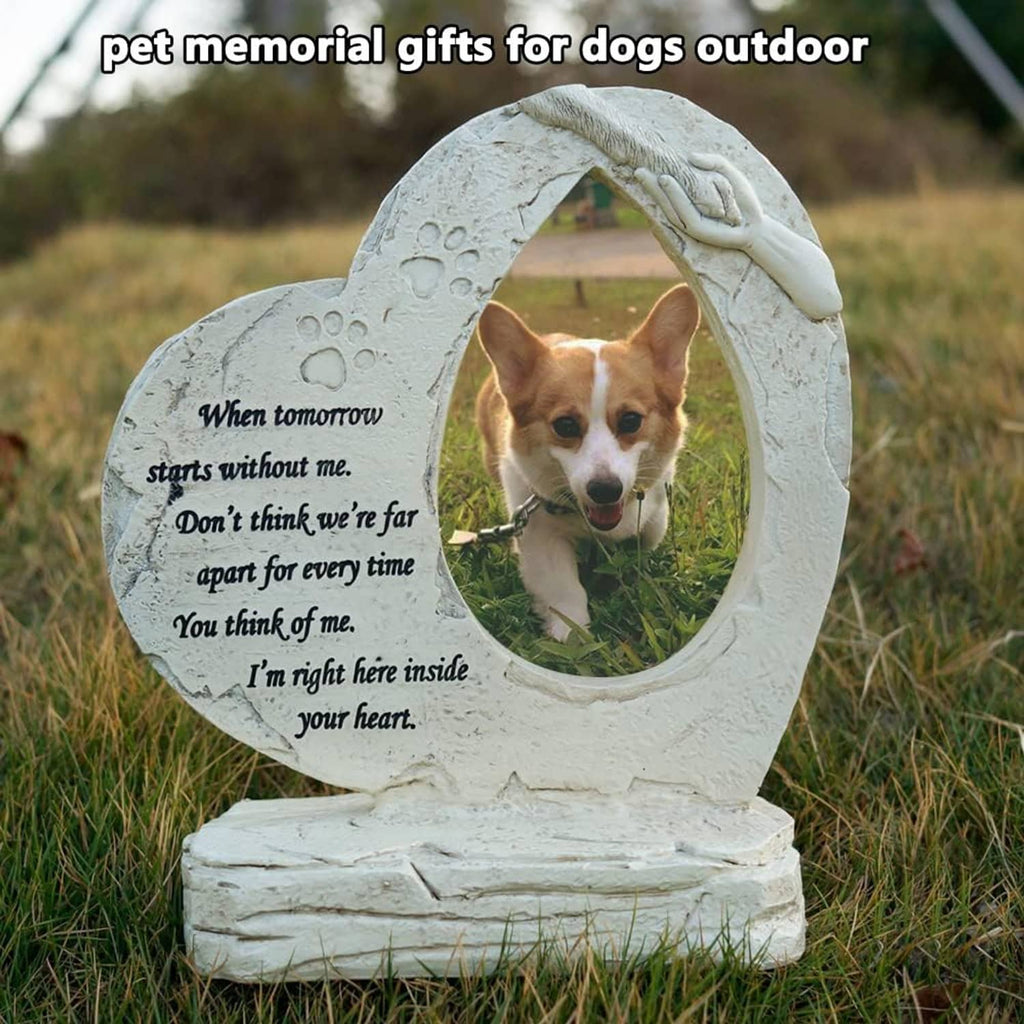 Heart-shaped outdoor dog memorial stone with oval photo frame and paw-print relief